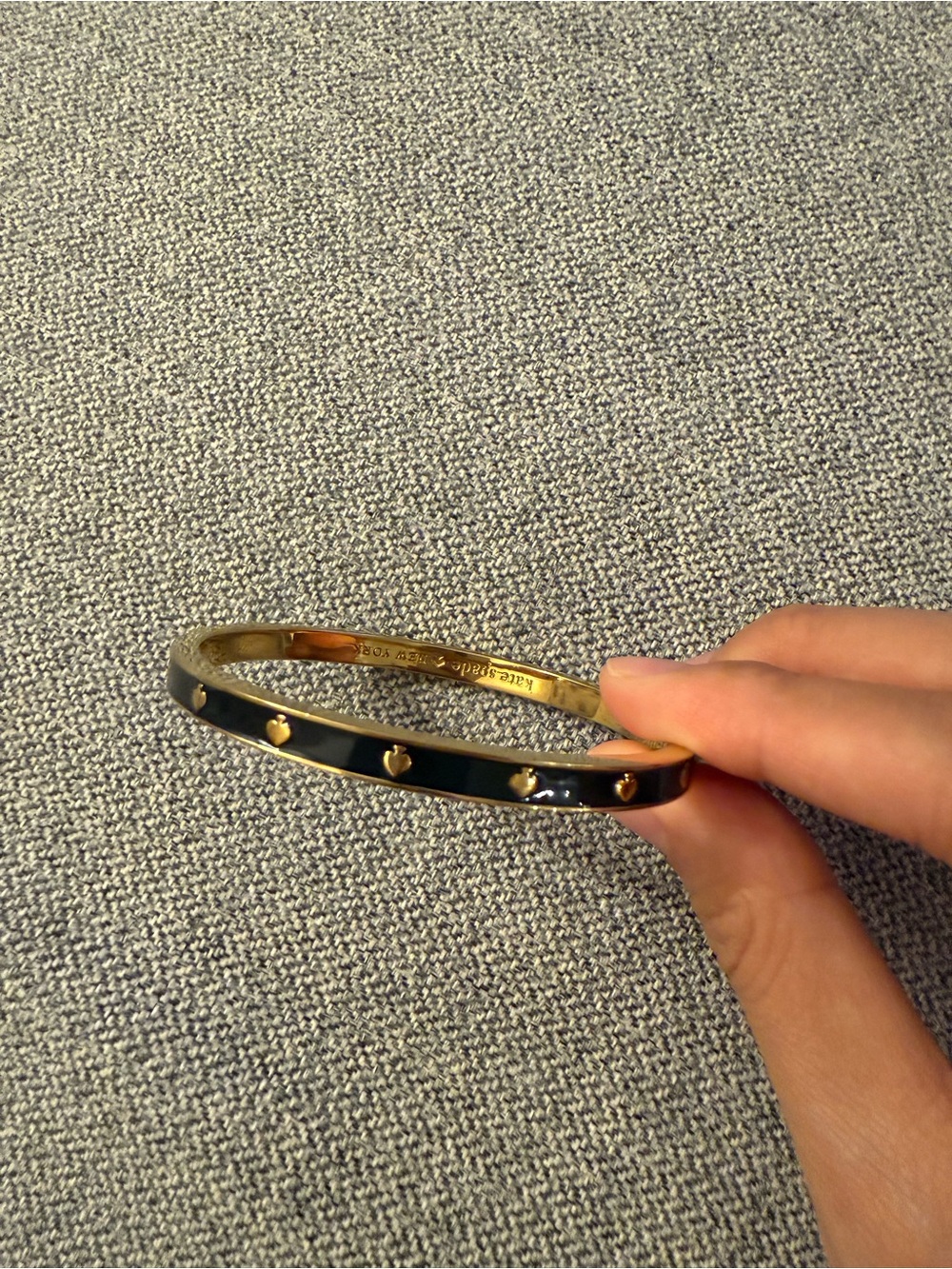 Kate Spade New York Gold Bangle Bracelet with Black Hearts